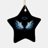 Zwevende engelenvleugels in het blauw op een zwart keramisch ornament (Rechts)