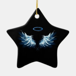 Zwevende engelenvleugels in het blauw op een zwart keramisch ornament