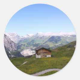 Zwitsers huis en alpen ronde sticker